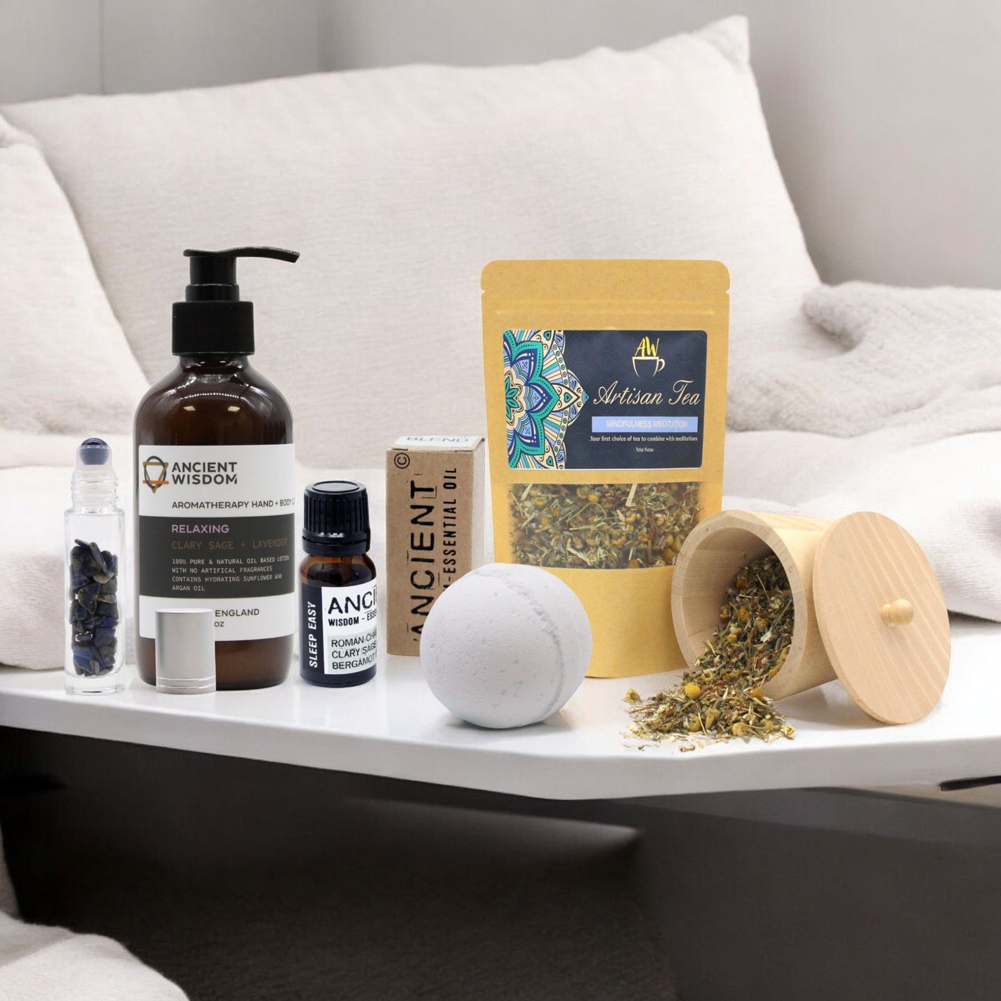 Luxurious wellness gift set featuring a lavender aromatherapy bath bomb and relaxing sleep essentials in elegant packaging.