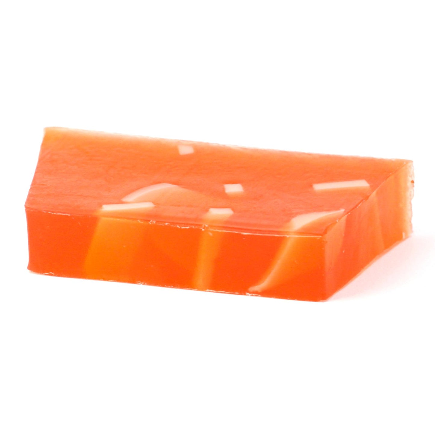 Handcrafted orange soap bar with visible zest texture on a neutral background.