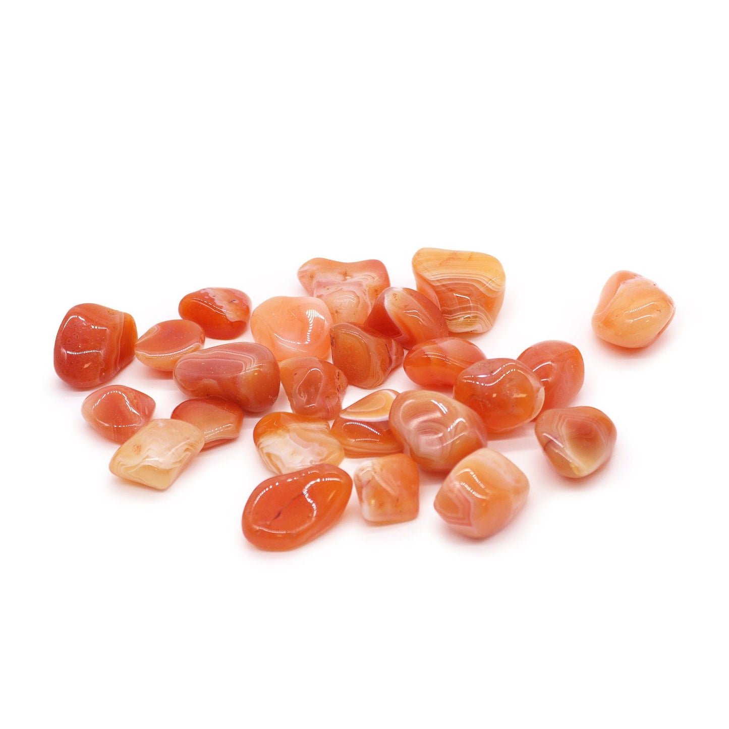 Smooth, highly polished carnelian tumble stone featuring vibrant shades of translucent orange and deep red.
