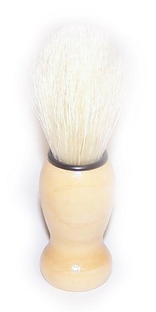 Traditional shaving brush with a classic wooden handle and soft, dense bristles for creating a rich lather.