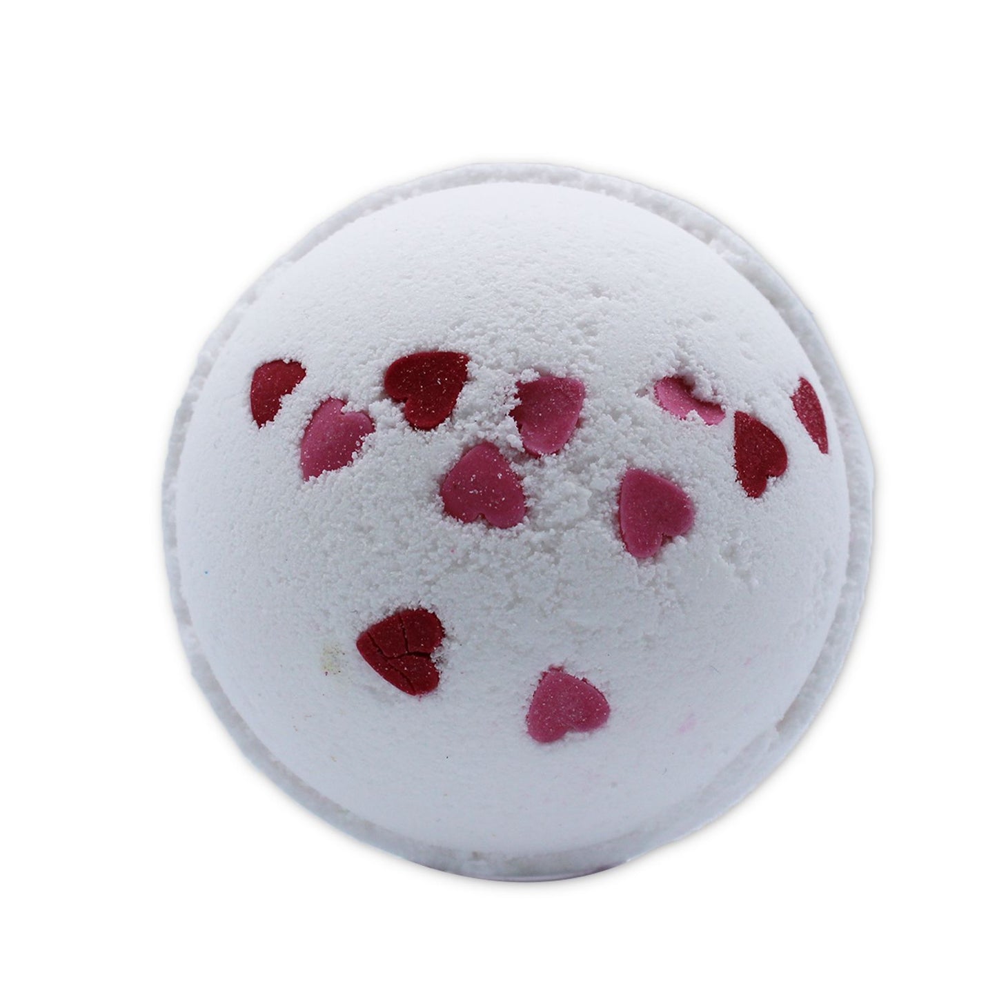 Heart-shaped pink bath bomb with delicate dried wild flower petals on a white background.