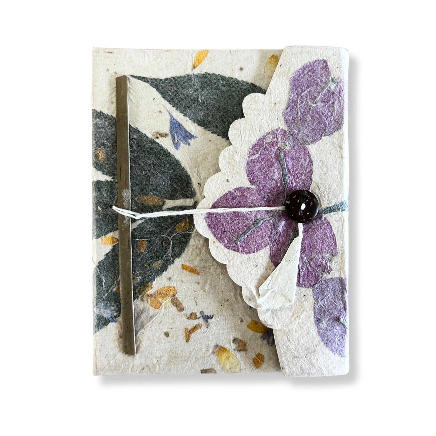 Large handmade Lokta paper notebook featuring vibrant purple pressed bougainvillea petals on a natural textured cover.