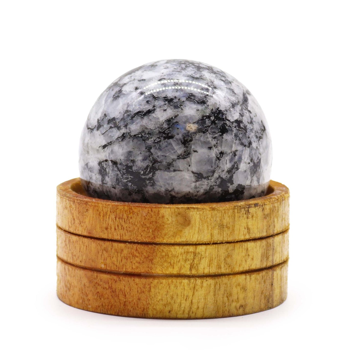 A smooth 50mm Indian Moonstone crystal sphere with a pearly white shimmer resting on a small wooden stand.