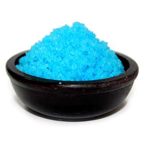 Small white scented simmering granules with a fresh cotton aroma for use in oil burners.