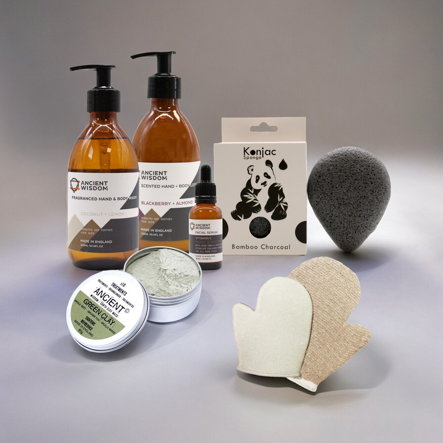 Skincare gift set featuring a bamboo charcoal konjac sponge and natural cleansing products for a radiant complexion.