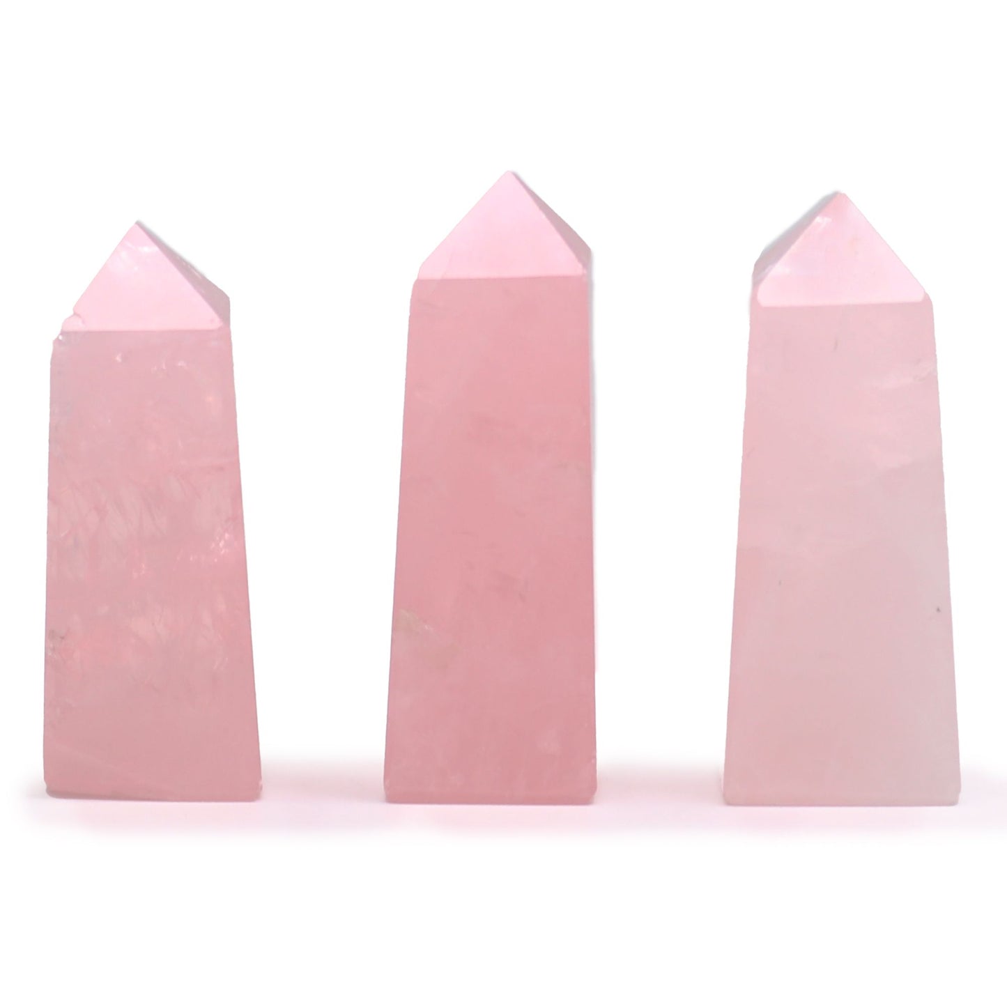 Small polished pink rose quartz gemstone obelisk point with a sharp tip and smooth sides.