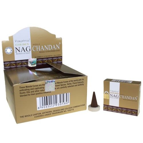 A pile of handcrafted golden incense cones with a smooth texture, ready for ritual use.