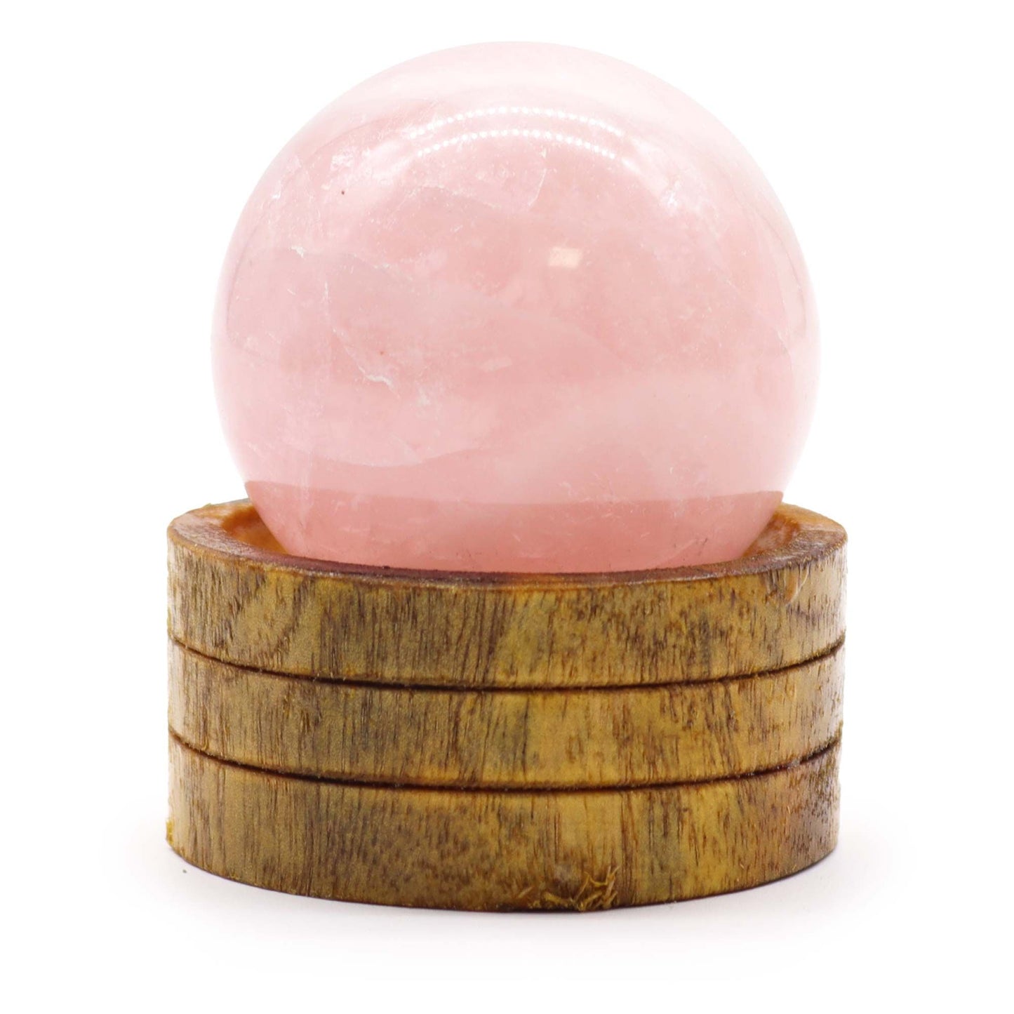 Polished soft pink rose quartz crystal sphere resting on a small wooden display stand.