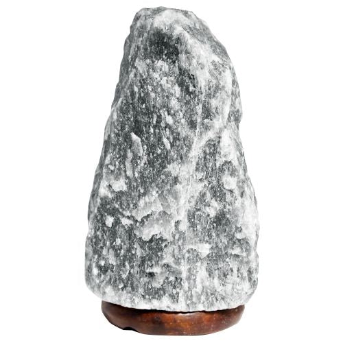 Natural hand-carved grey Himalayan salt lamp on a wooden base emitting a soft warm glow.