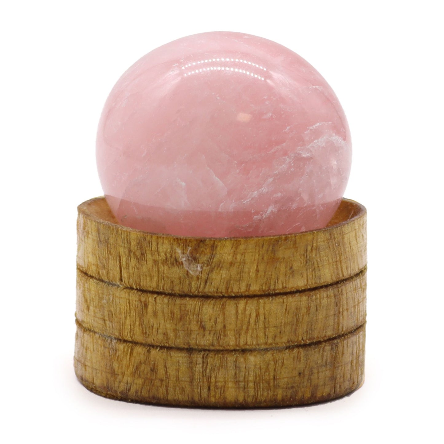 A polished pink rose quartz crystal sphere resting on a small black display stand.