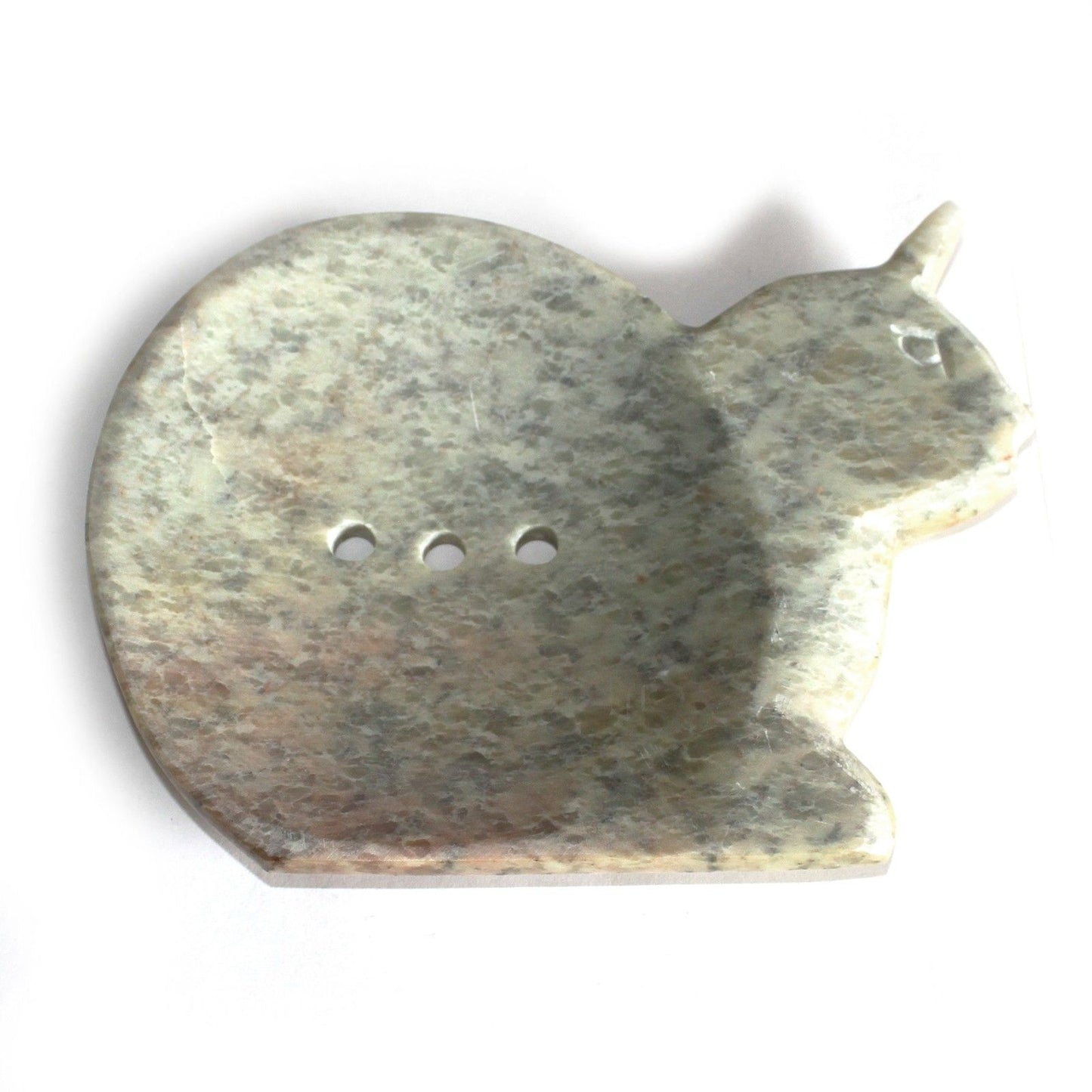 Hand-carved natural soapstone soap dish in the shape of a sitting cat with three drainage holes in the centre.
