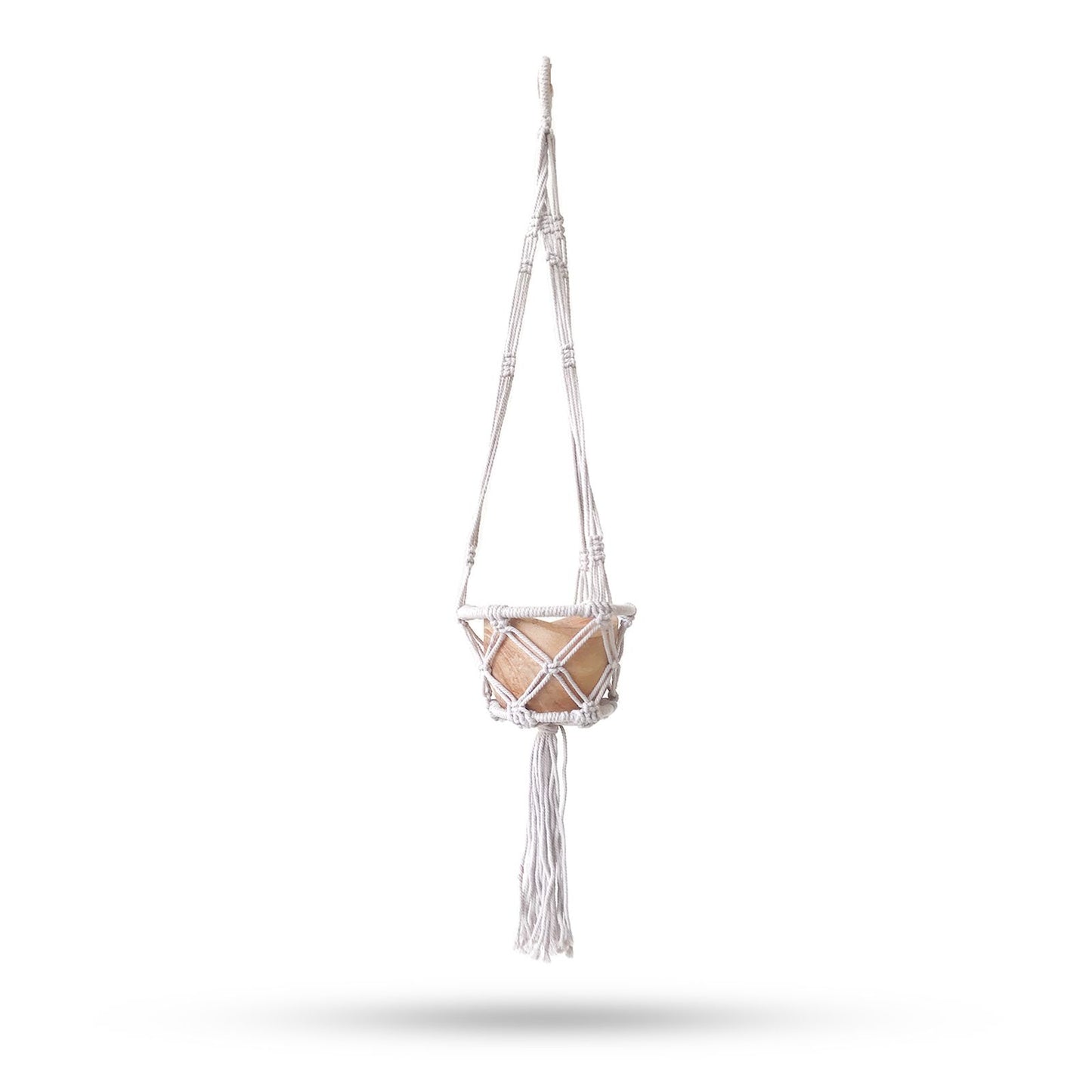 Small natural cotton macrame plant hanger featuring a wooden hoop and intricate knot patterns for indoor pots.