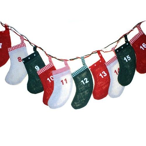 Rustic jute advent calendar featuring twenty-four mini numbered stockings hanging from a natural twine string.