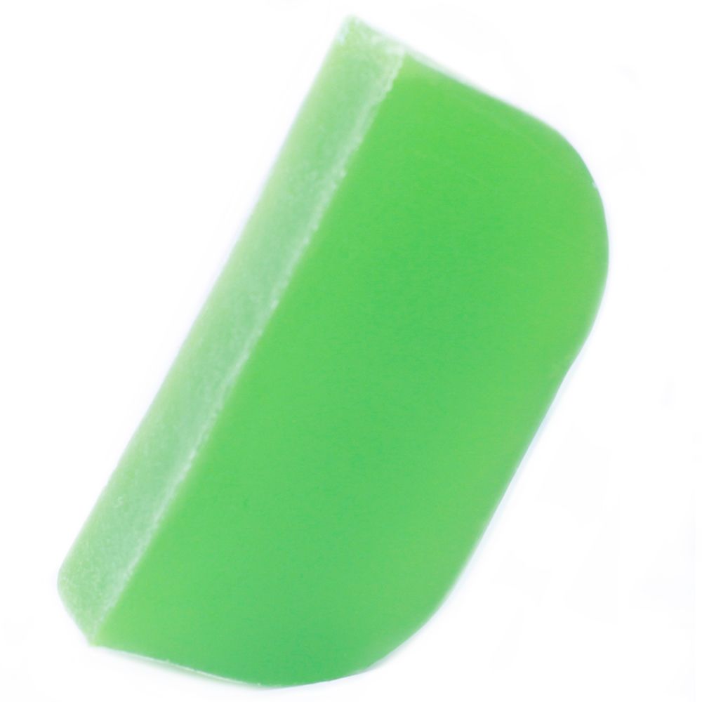 A textured slice of green solid shampoo bar infused with thyme and mint leaves, showing a natural artisan finish.