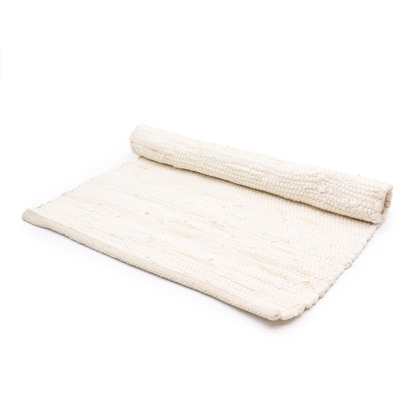 Handwoven cream cotton rug with a textured handloom finish, ideal for a minimalist or spiritual home interior.