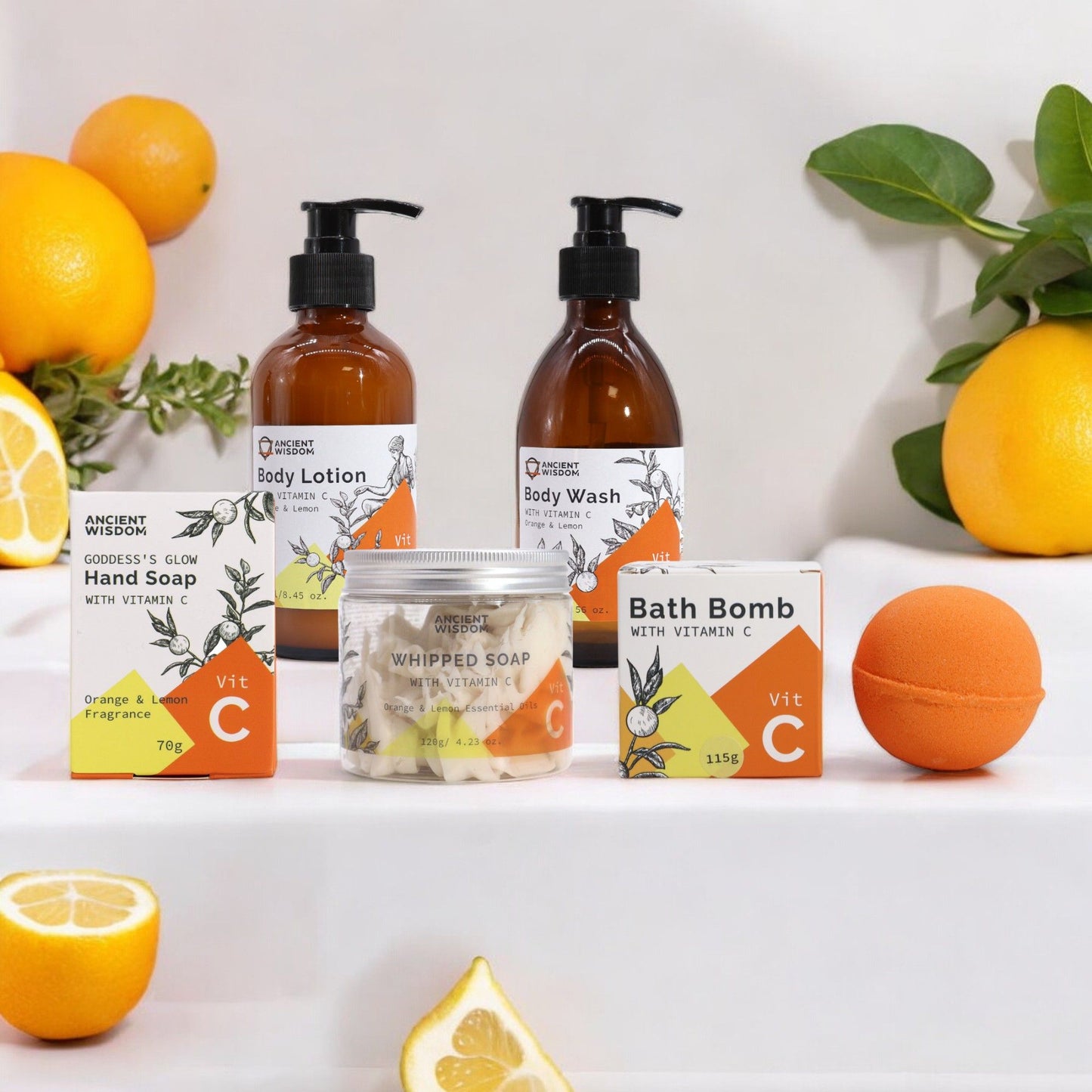 Luxurious wellness bundle featuring Vitamin C enriched hand soap and citrus themed self care products on a bright surface.