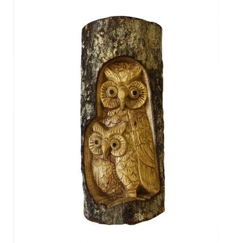 Intricate hand-carved wooden owl family sculpture featuring a Man of the Wood face on a natural tree stump base.