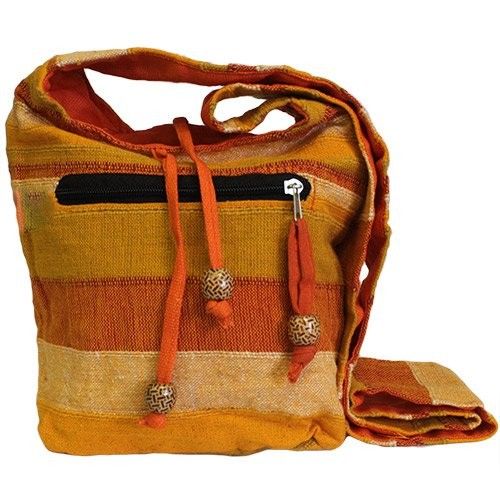 Vibrant sunrise orange fabric sling bag with a wide shoulder strap and functional external pockets.