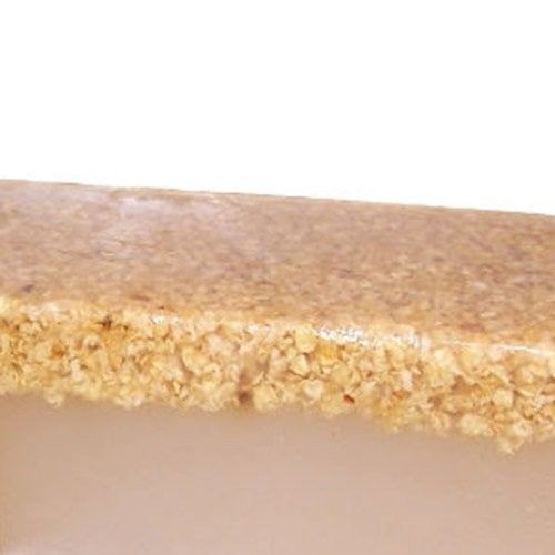 Large 10kg block of natural honey and oatmeal artisanal soap with visible oat grains and a creamy texture.