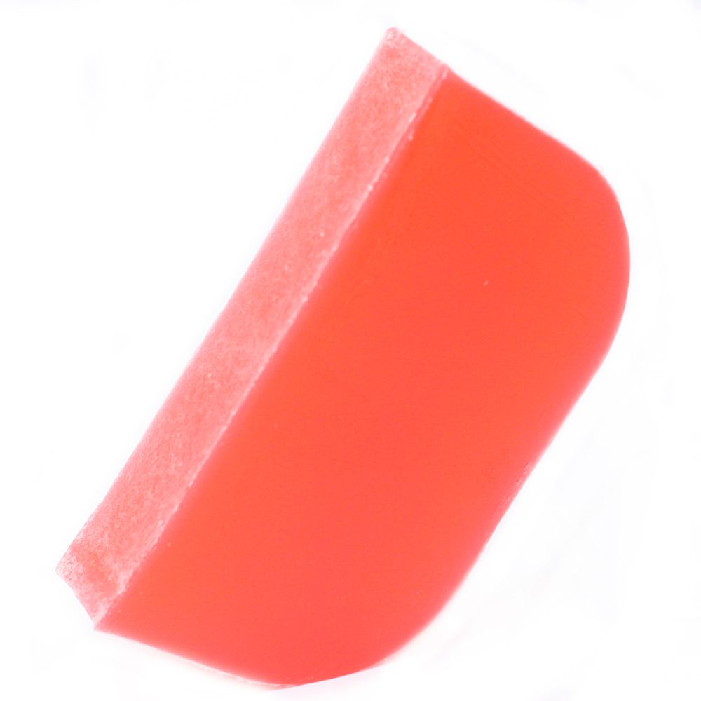 Handmade solid shampoo bar slice with vibrant colours, infused with ylang ylang and orange essential oils.