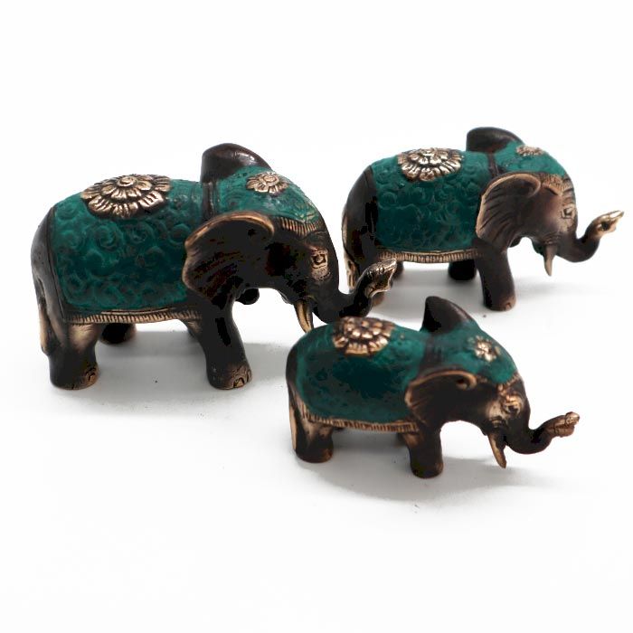 Three polished brass elephant statues in varying sizes, featuring raised trunks for good luck and prosperity.