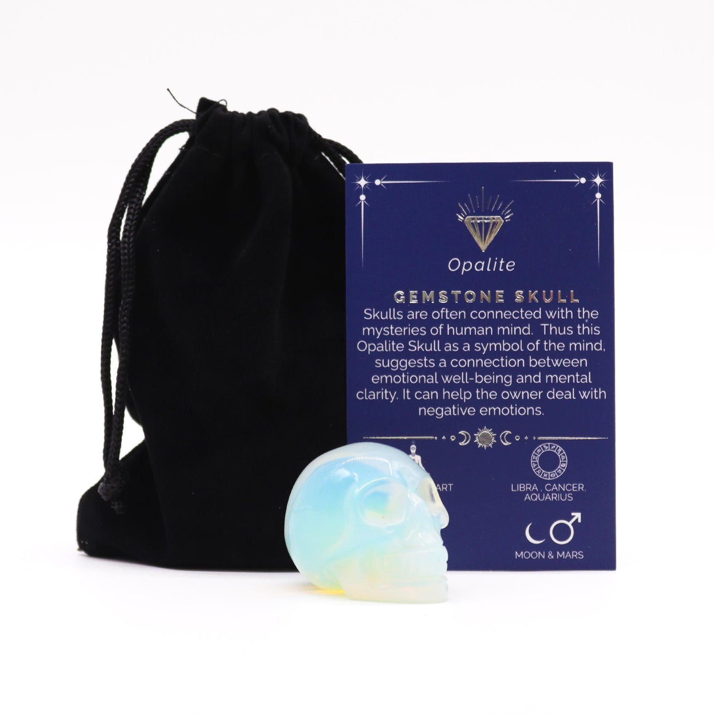 A small, hand-carved gemstone skull made from iridescent milky-white opalite with smooth, polished surfaces.