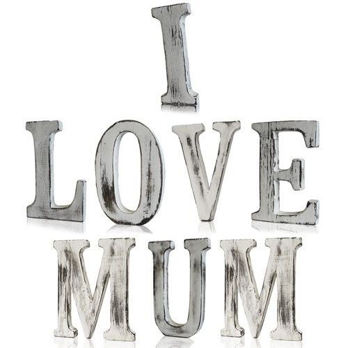 Handmade white-wash wooden alphabet letters spelling I LOVE MUM in a rustic shabby chic style.