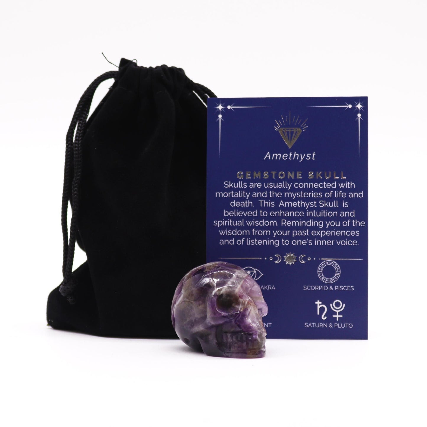 Small hand-carved purple amethyst gemstone skull with natural crystalline inclusions and polished finish.