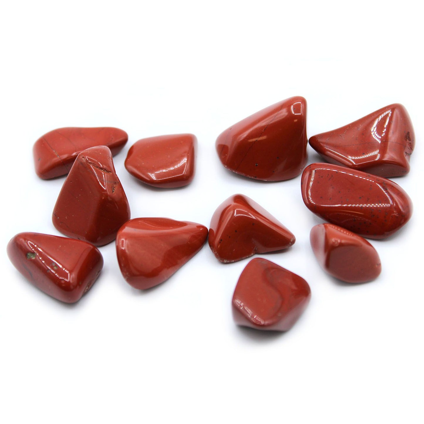 A large, smooth and highly polished Red Jasper tumbled stone featuring deep earthy red tones and natural patterns.