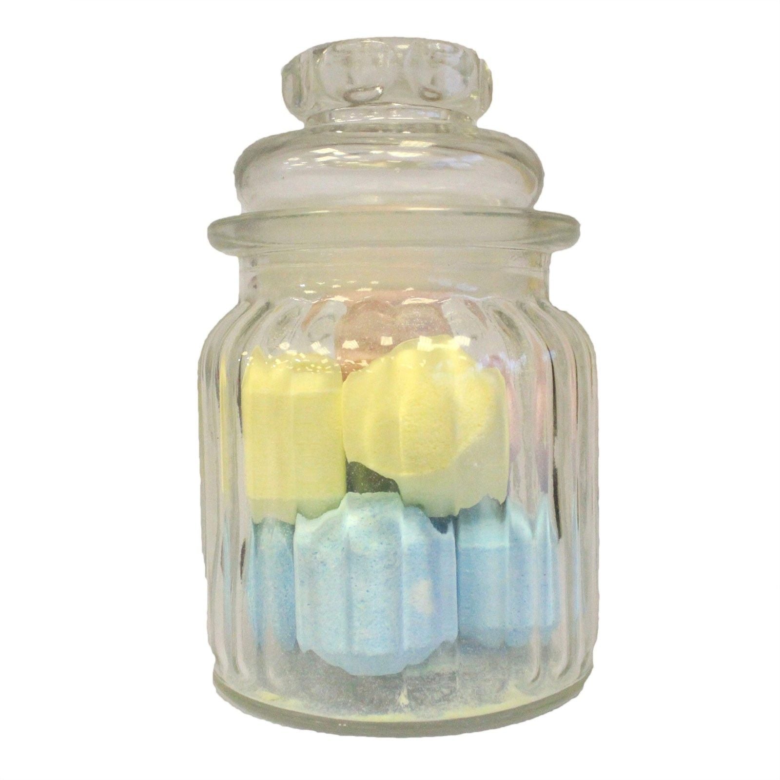 Elegant clear glass storage jar with a vertical ribbed texture and a matching glass lid.