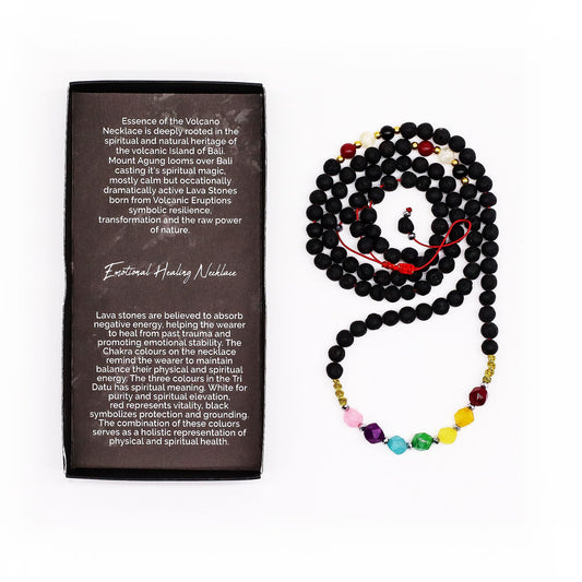 Lava stone necklace featuring a rainbow of seven colourful chakra beads on a simple black cord.