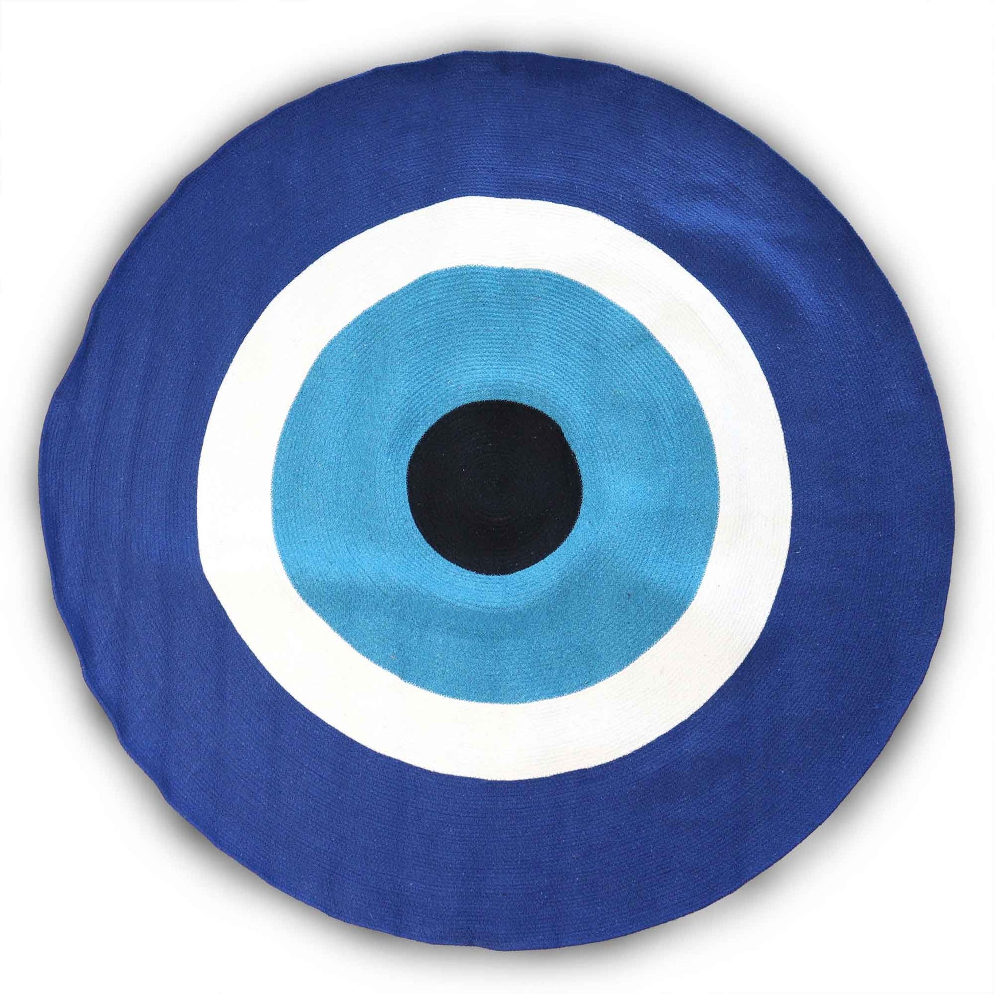 Large circular white cotton rope rug featuring a central blue and black evil eye protective symbol.
