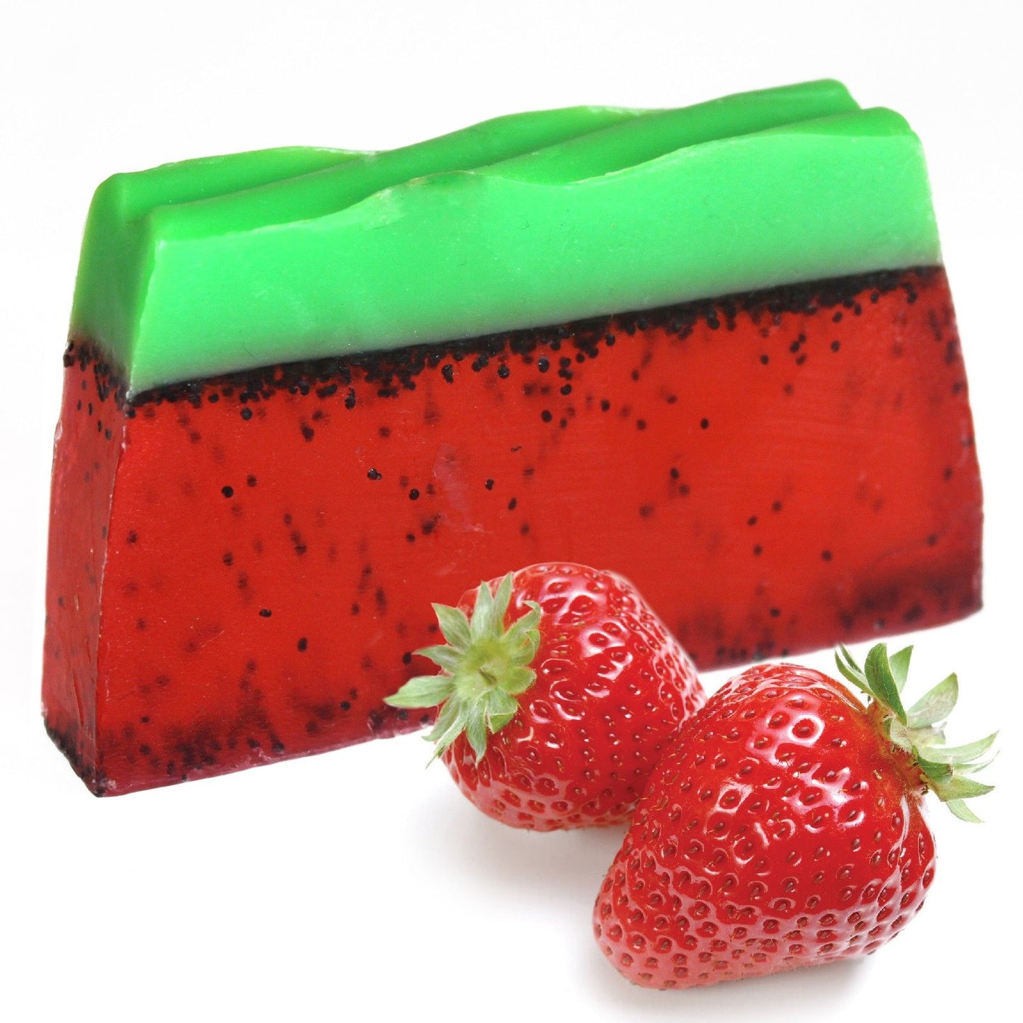 Large artisanal pink strawberry soap loaf textured with natural poppy seeds for gentle exfoliation.