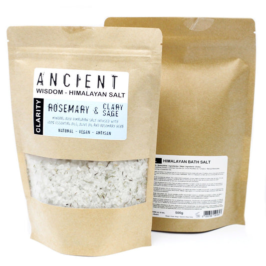 Mineral-rich pink Himalayan bath salts blended with dried rosemary herbs in a clear glass jar.