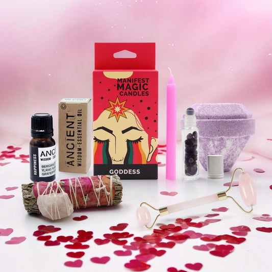 Curated wellness gift box featuring a smudge stick and luxurious self-care products for a relaxing home ritual.