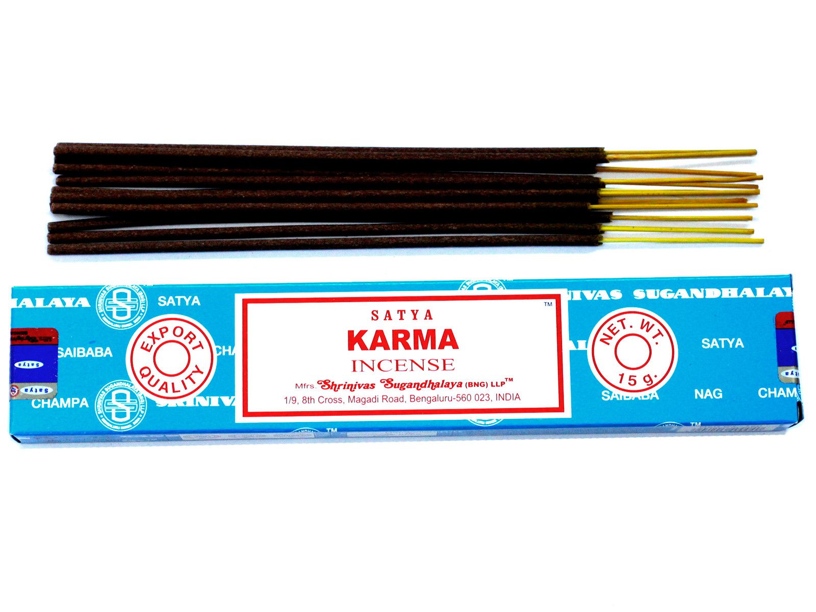 Hand-rolled incense sticks in a blue box with a sunburst design, releasing a gentle trail of aromatic smoke.