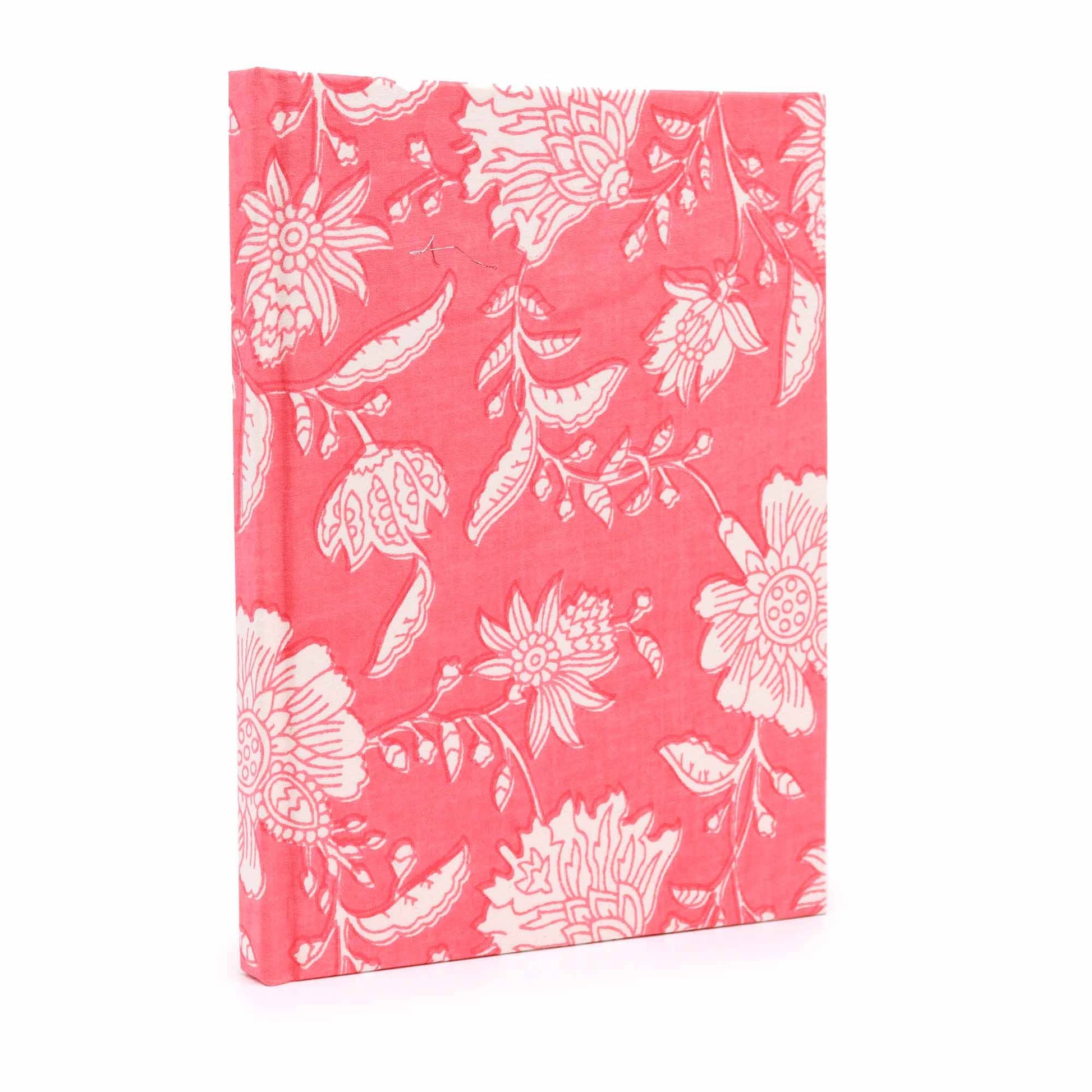 Handmade cotton bound notebook featuring a vibrant pink floral pattern on a soft fabric cover.