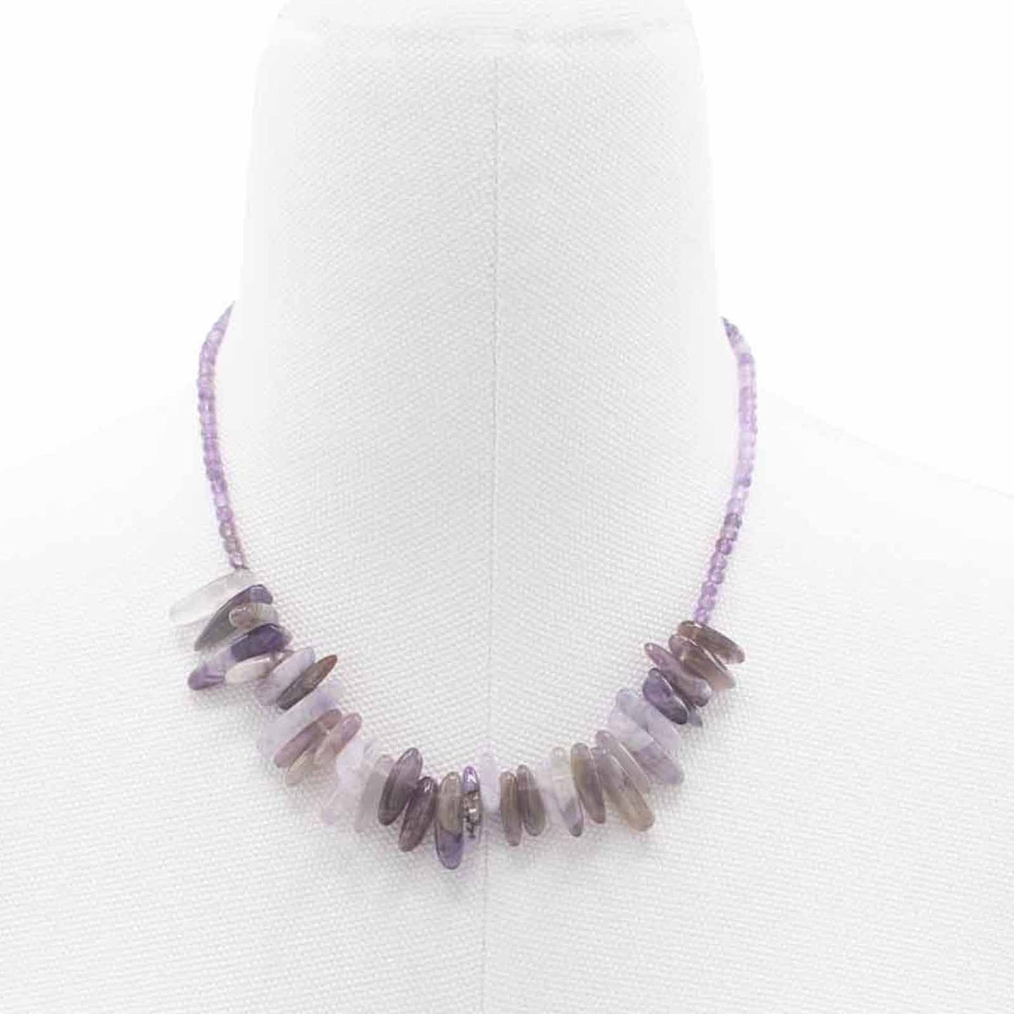 Elegant longstone necklace featuring polished deep purple amethyst gemstones on a delicate silver-tone chain.