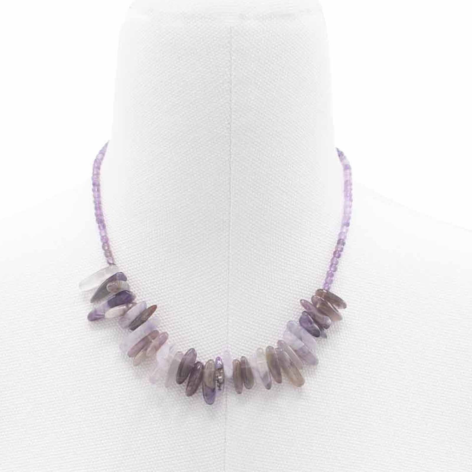 Elegant longstone necklace featuring polished deep purple amethyst gemstones on a delicate silver-tone chain.