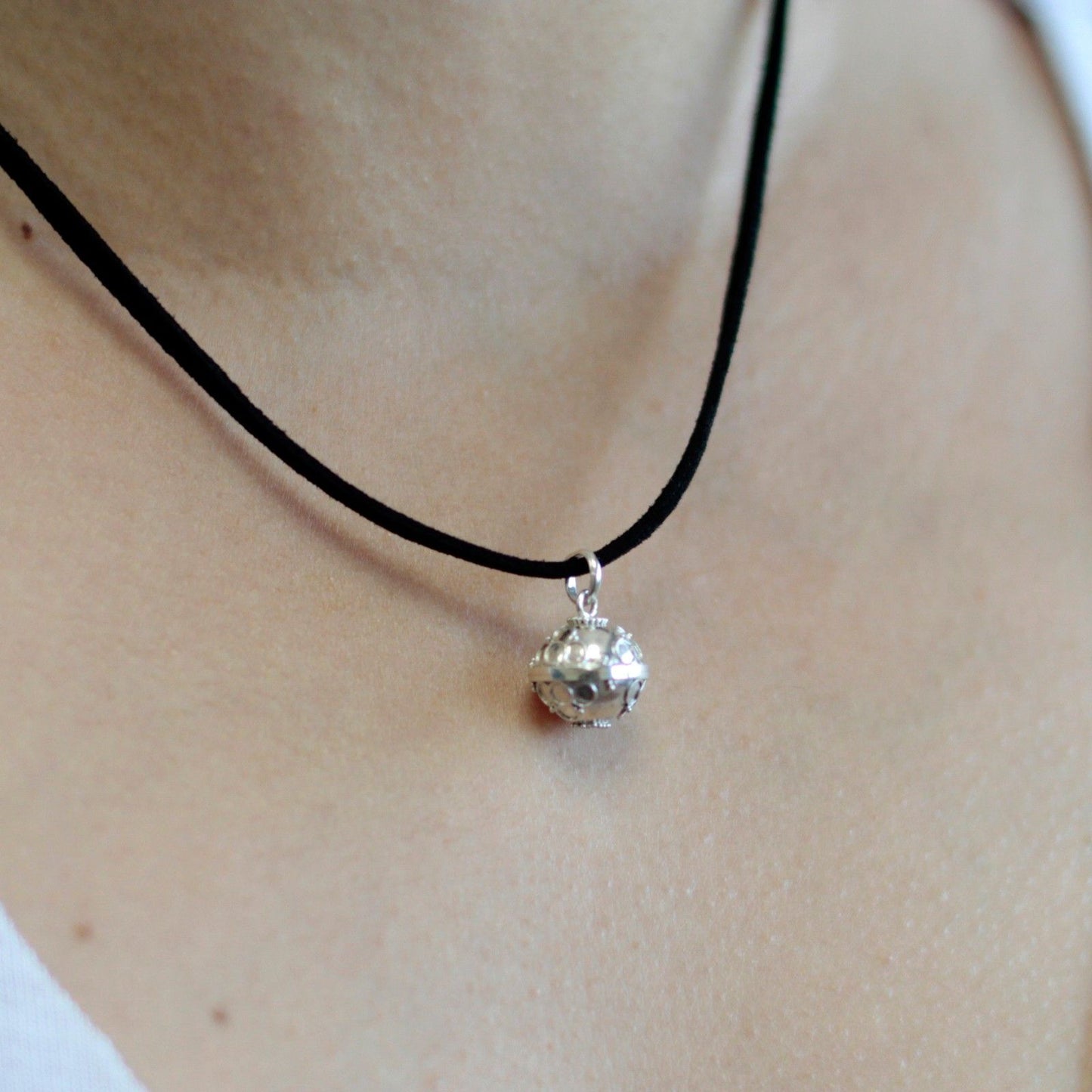 Intricate 16mm 925 sterling silver angel bell pendant with ornate traditional Balinese metalwork patterns.