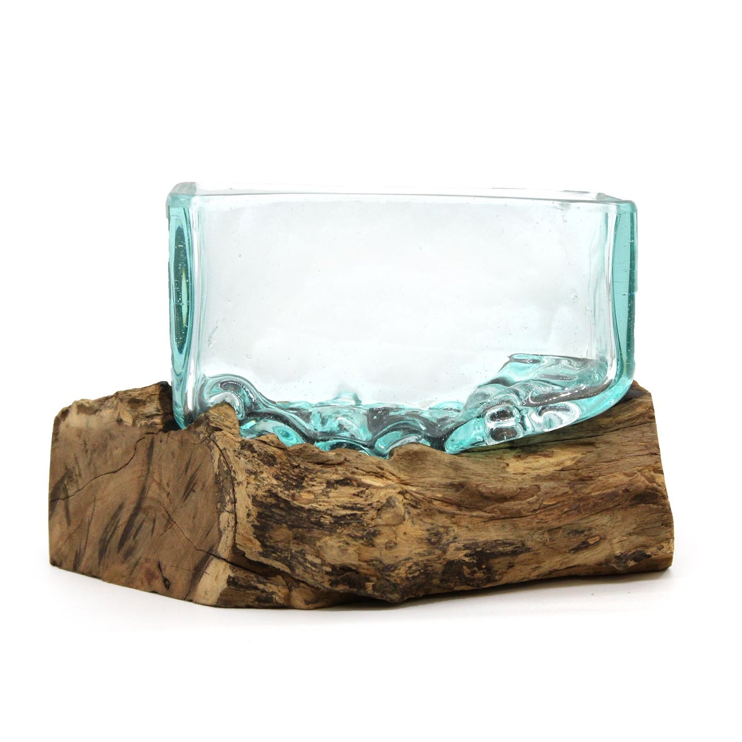 Handcrafted molten glass bowl delicately slumped over a natural teak wood root base on a minimalist stand.
