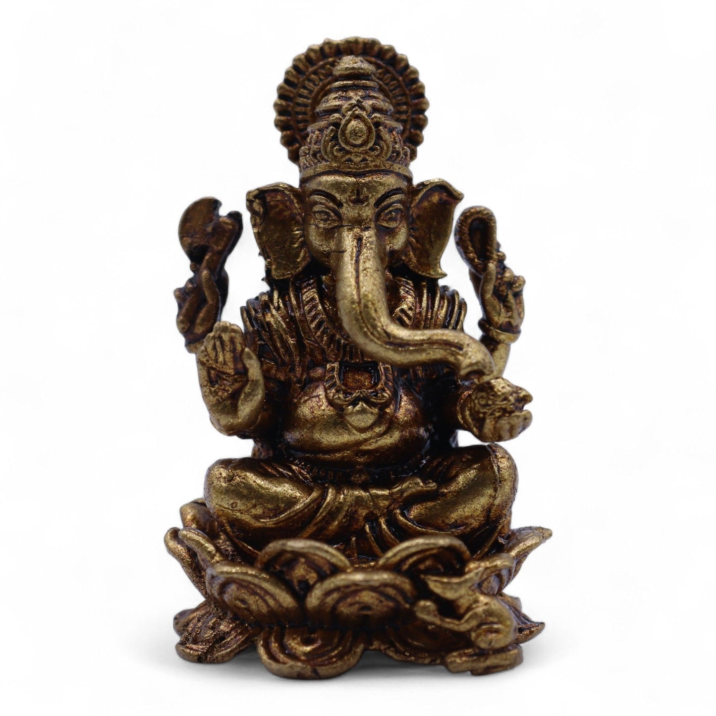 Handcrafted miniature solid brass Ganesha statue featuring intricate detailing on a decorative lotus base.