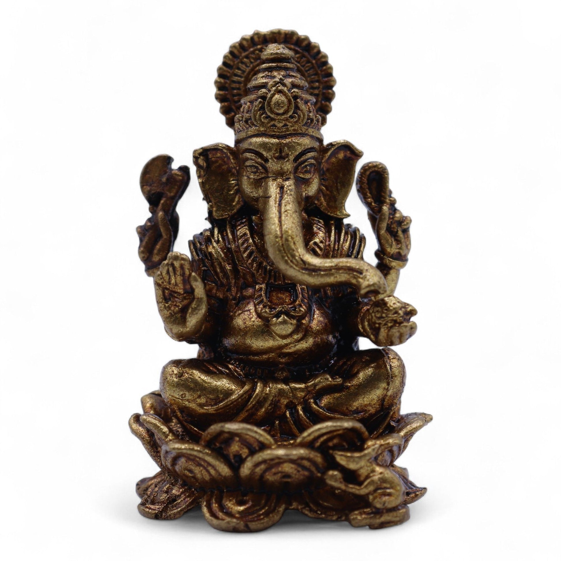 Handcrafted miniature solid brass Ganesha statue featuring intricate detailing on a decorative lotus base.