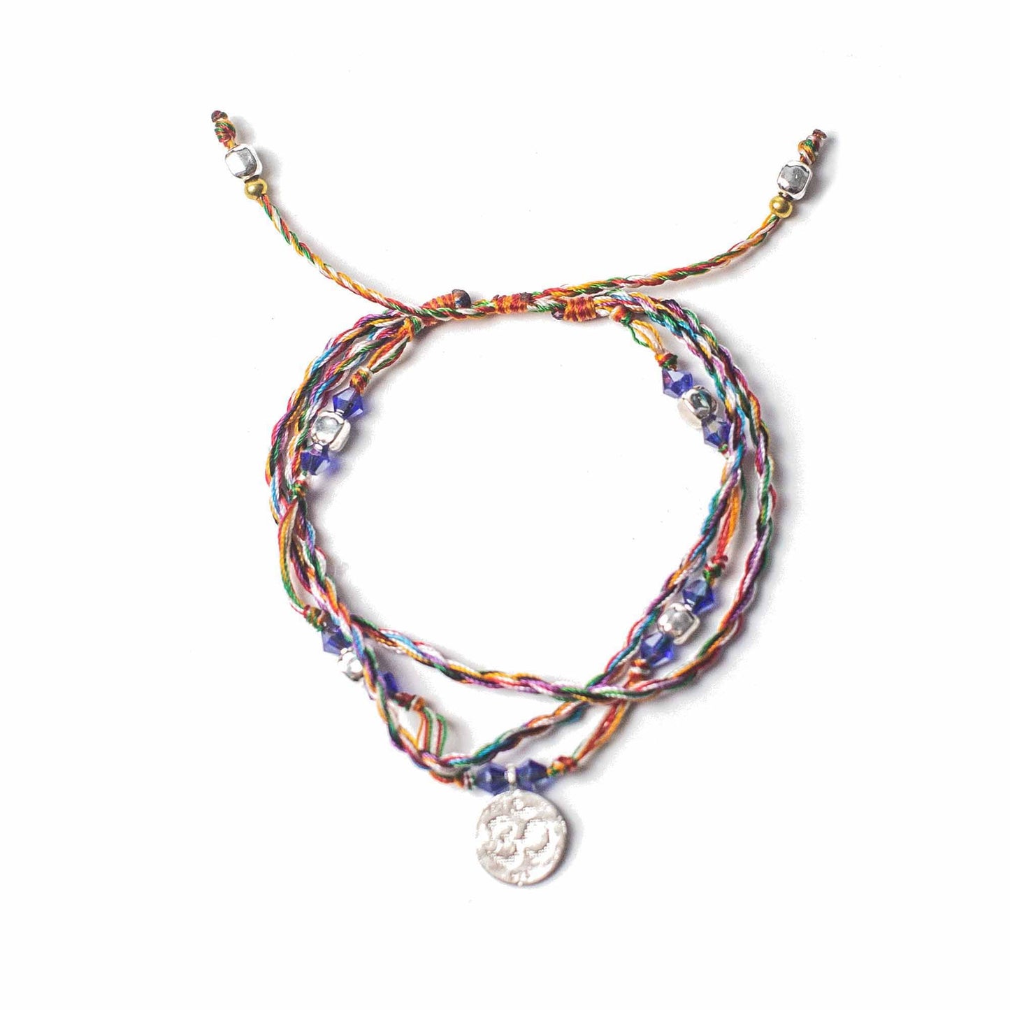 Handcrafted red string bracelet featuring a silver-tone Om symbol charm for spiritual connection and mindfulness.