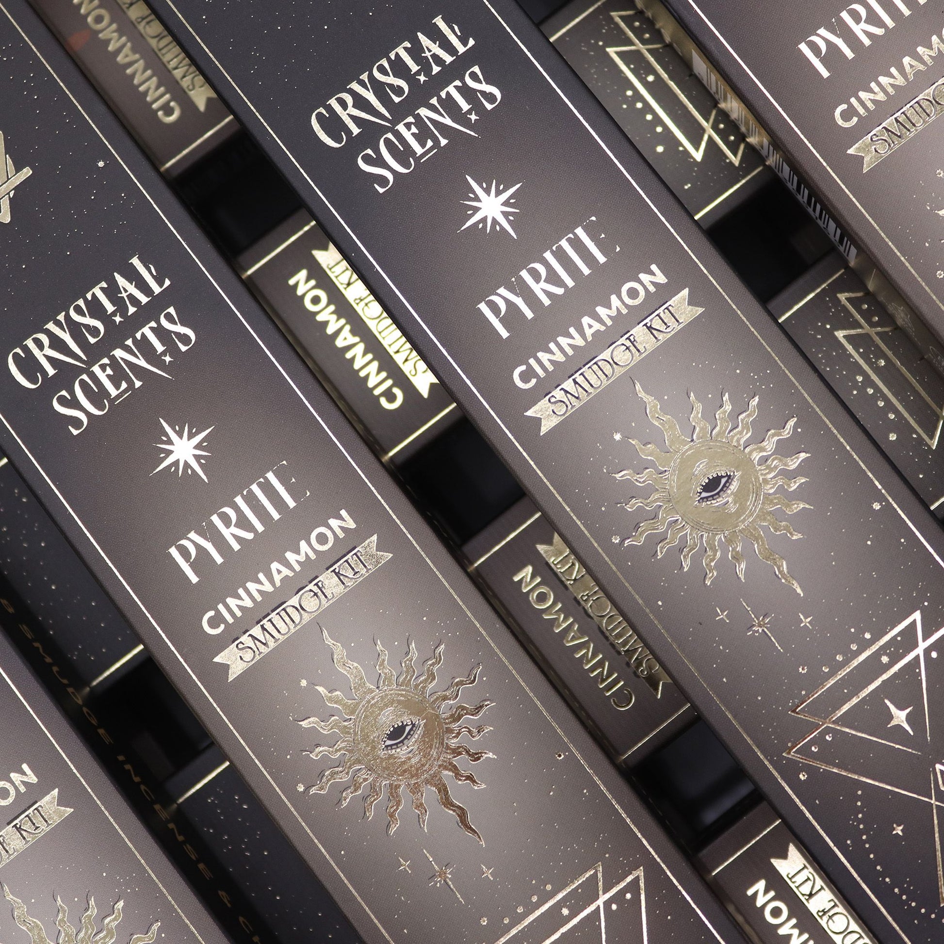 Handcrafted cinnamon incense sticks embellished with golden pyrite crystal stones in a decorative box.