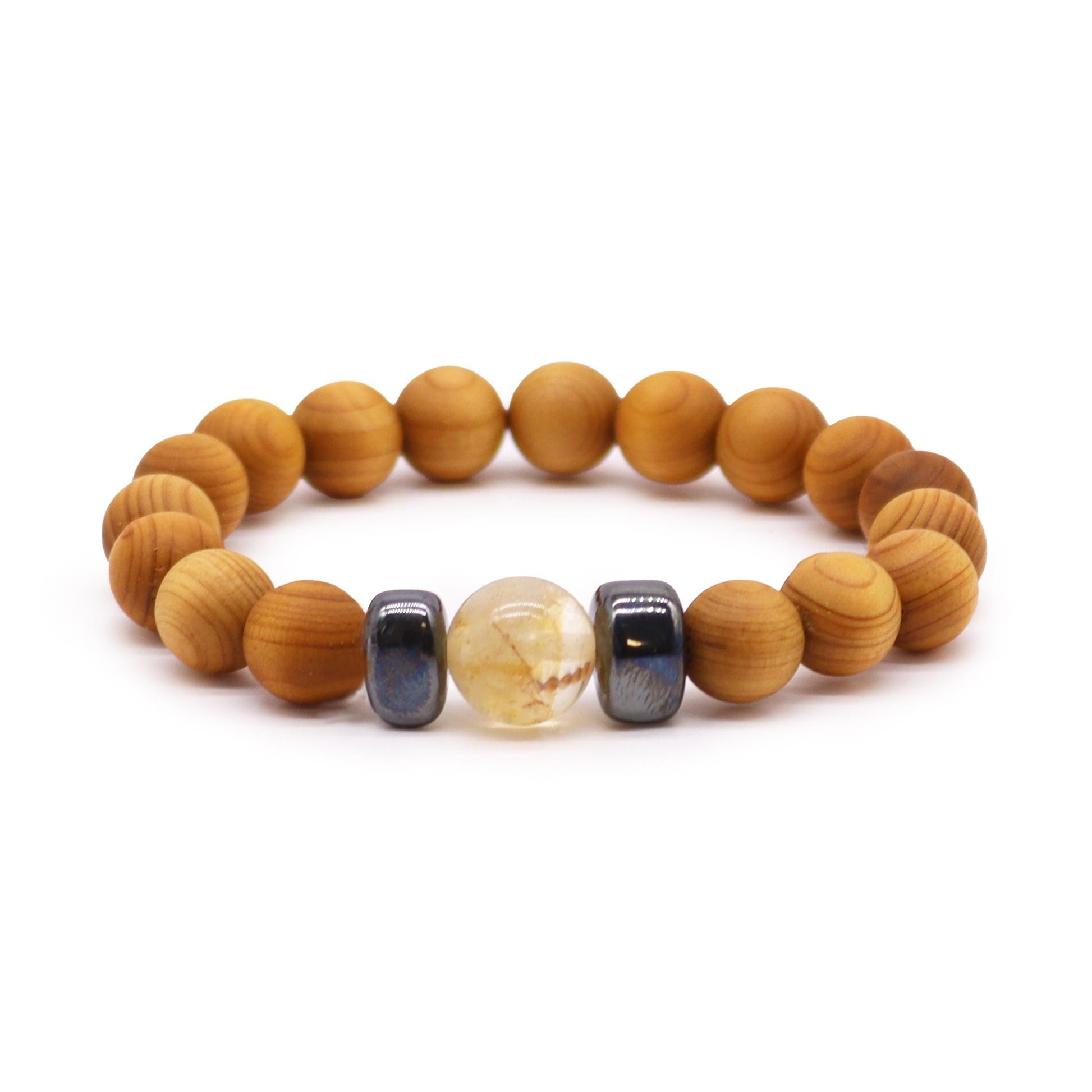 Handcrafted cedarwood bangle featuring a yellow citrine gemstone for solar plexus chakra healing and personal power.