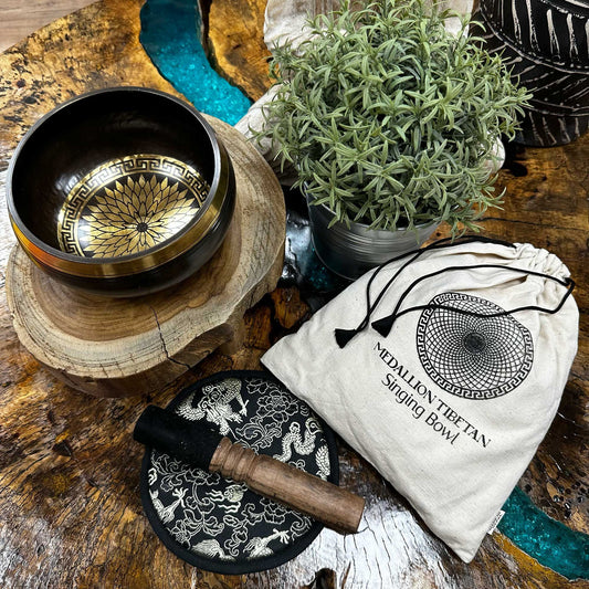 Handcrafted 14cm singing bowl with intricate round medallion engravings, wooden mallet, and plush cushion in a gift set.