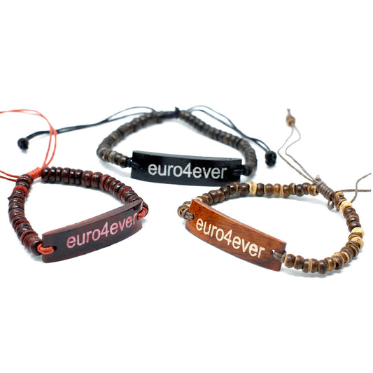 Handcrafted coco beaded stretch bracelet featuring a unique slogan bead on a wrist.
