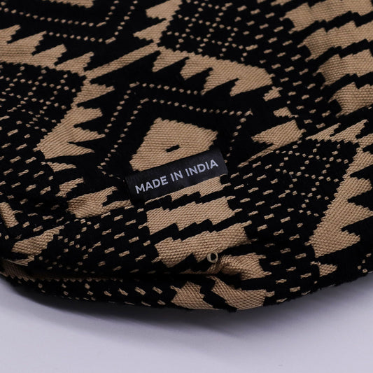 Square jacquard fabric tote bag with an earthy geometric pattern and woven shoulder straps.