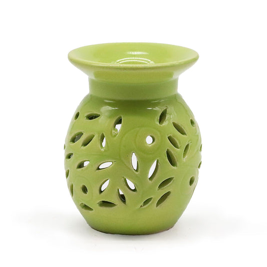 Elegant lime green ceramic oil burner featuring a decorative floral cut-out design for tealight candles.